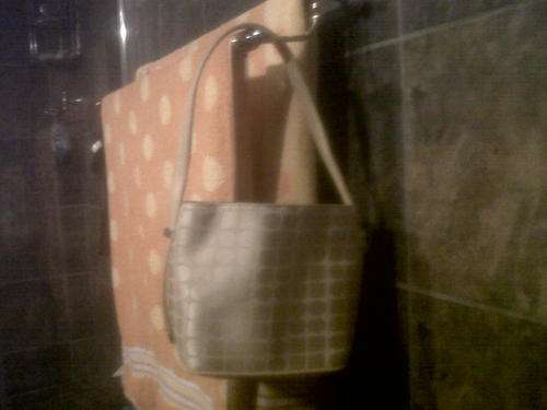 Gold box-shaped bag with adjustable strap