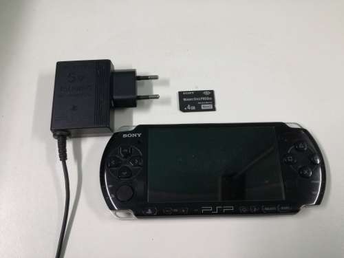 PSP + Charger + Memory Card + Games