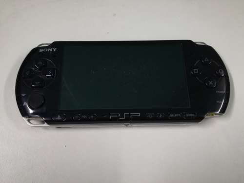 PSP + Charger + Memory Card + Games