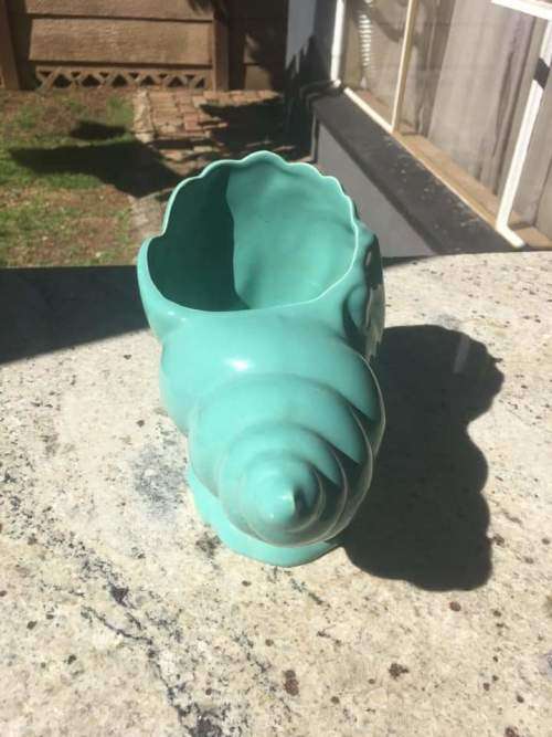 Lucia ware shell flower vase in mint condition.