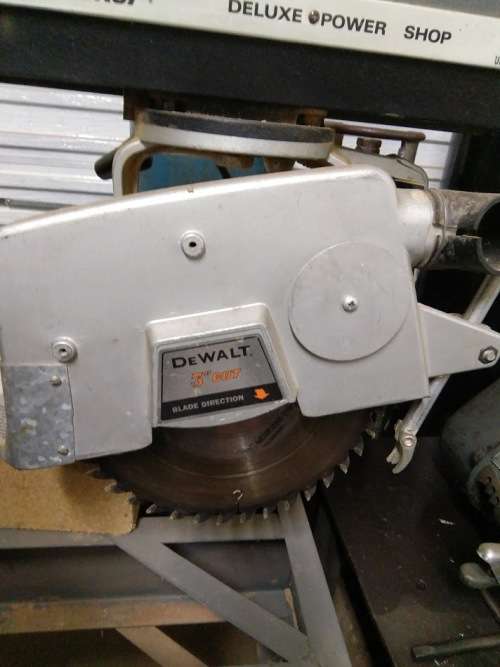 3KW 220V DEWALT BLACK & DECKER RADIAL ARM SAW ON TABLE.