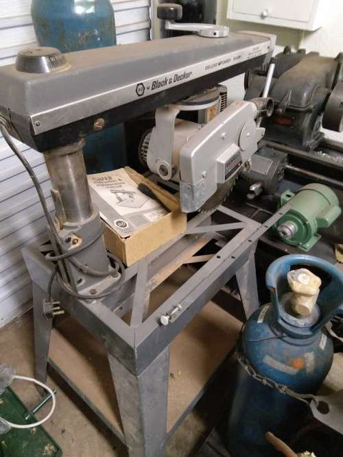 3KW 220V DEWALT BLACK & DECKER RADIAL ARM SAW ON TABLE.