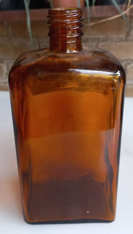 The JR Watkins Co amber glass medicine bottle