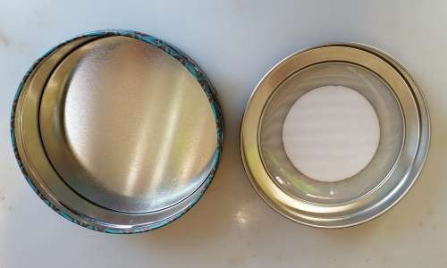 Chocolate coated assorted nuts tin
