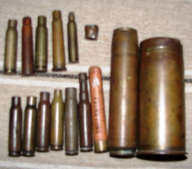 COLLECTION OF BRASS CARTRIDGES~PLUS A SLUG AND A 410 PAPER CARTRIDGE