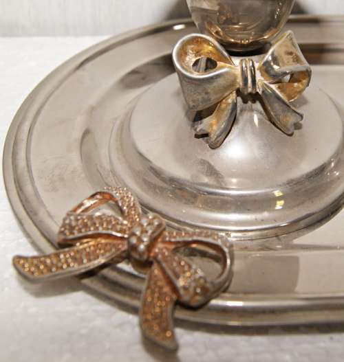 EPNS candlesticks with bow motif on tray