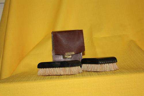 Brushes in original leather casing.