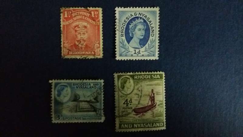 Rhodesia & Nyasaland  King George 1922 1d & Queen Elizabeth 1954 1d , 1959 3d & 4d.