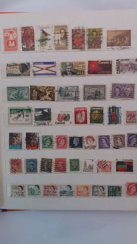 + 621 World Stamps from 1960s including RSA in Vintage Flying Eagle Album 16 Pages * 32x26x2*