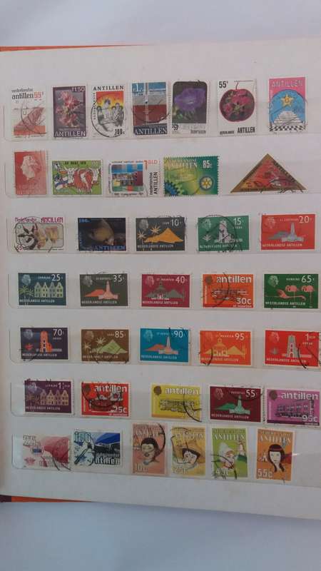 + 621 World Stamps from 1960s including RSA in Vintage Flying Eagle Album 16 Pages * 32x26x2*