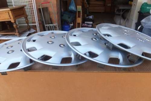SET OF 4 MIDAS 14" .HUB CAPS. BRAND NEW