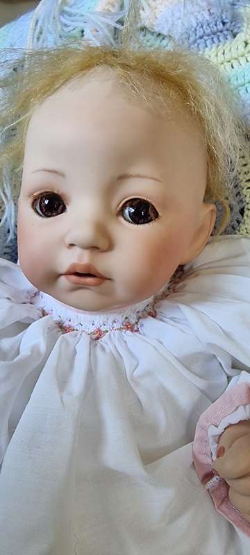 Sweet happy porcelain doll baby girl