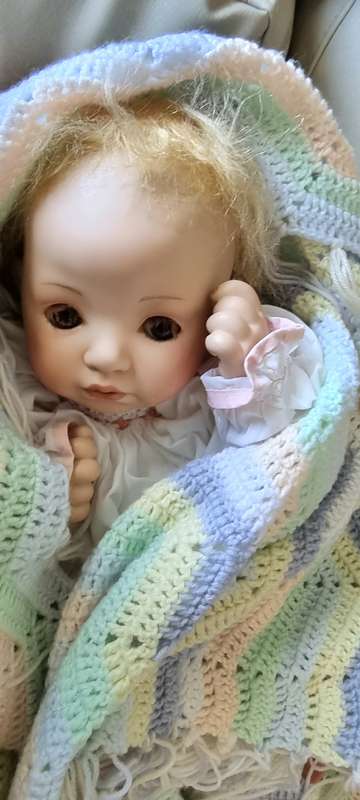 Sweet happy porcelain doll baby girl