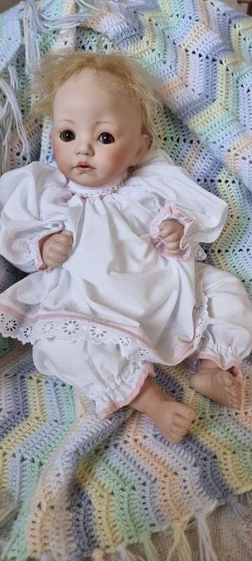 Sweet happy porcelain doll baby girl