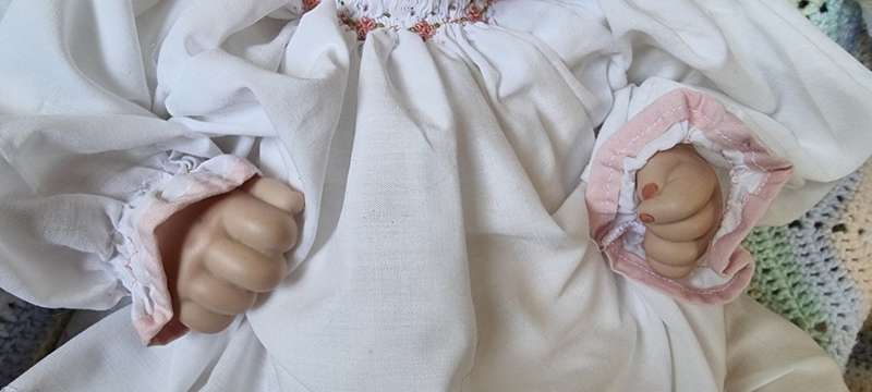 Sweet happy porcelain doll baby girl