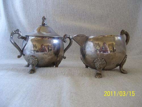 Very old silver plated milk jug and sugar bowl
