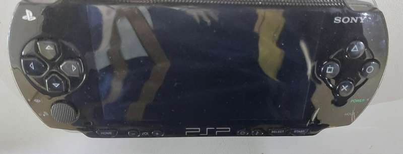 PSP (new battery) + 12 Games (most still have manuals)