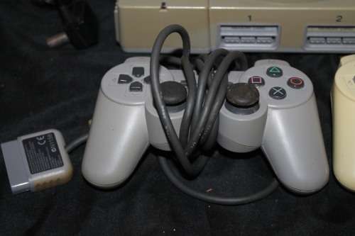 Sony Playstation One with two controllers