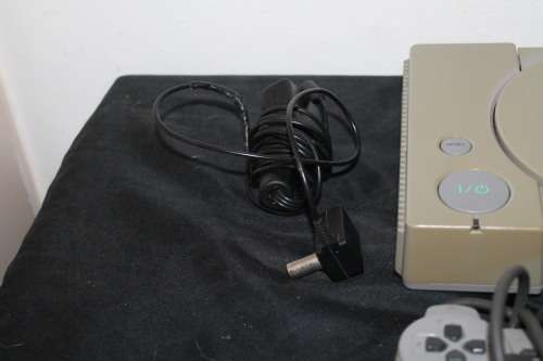 Sony Playstation One with two controllers