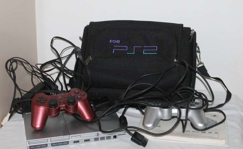 PlayStation 2  with 2 Controller`s, Memory Card, bag and manual