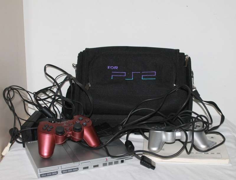 PlayStation 2  with 2 Controller`s, Memory Card, bag and manual