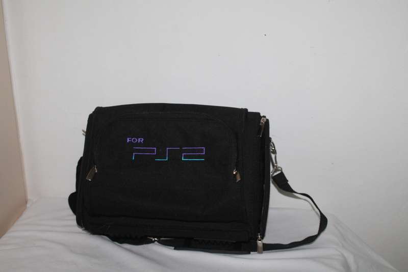 PlayStation 2  with 2 Controller`s, Memory Card, bag and manual