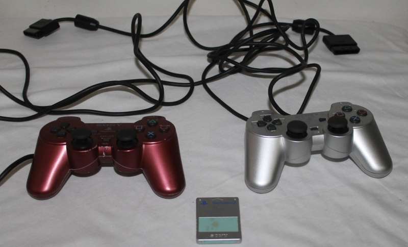 PlayStation 2  with 2 Controller`s, Memory Card, bag and manual