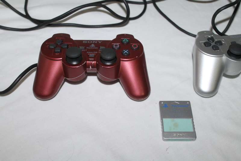 PlayStation 2  with 2 Controller`s, Memory Card, bag and manual