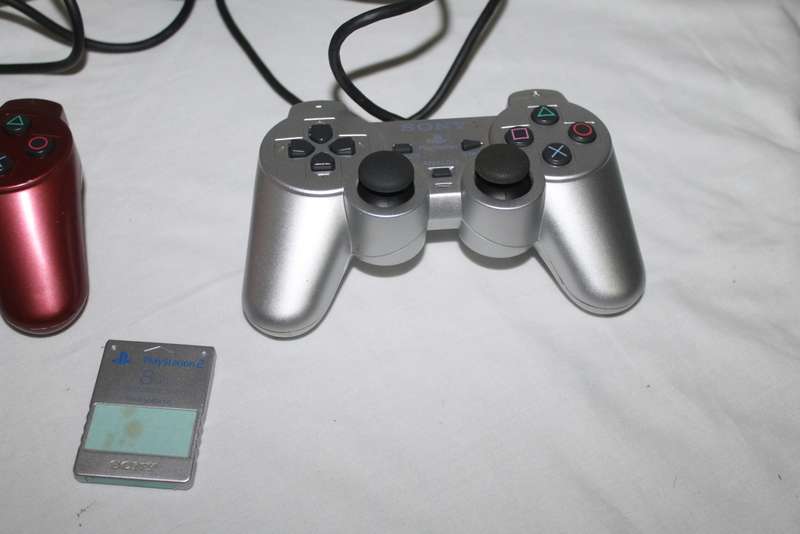 PlayStation 2  with 2 Controller`s, Memory Card, bag and manual