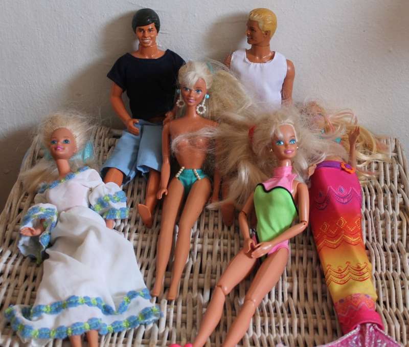 2 Ken dolls and 4 Barbies