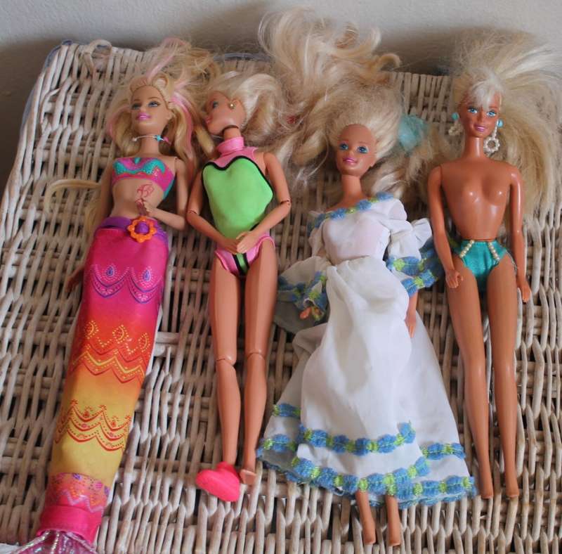 2 Ken dolls and 4 Barbies