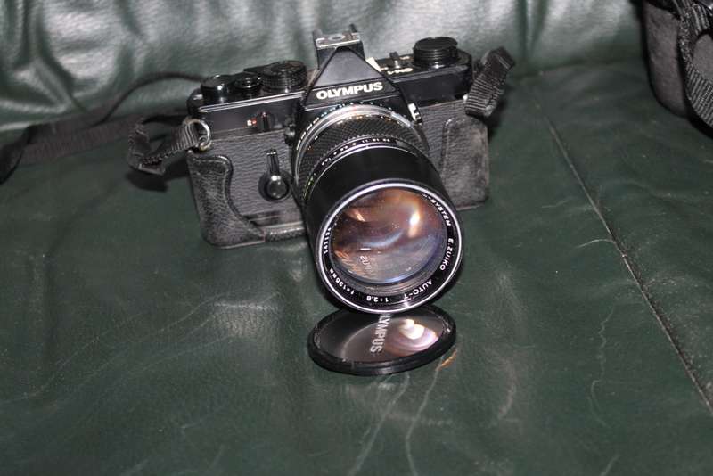 Olympus OM 1 Film Camera with three lenses