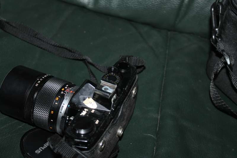 Olympus OM 1 Film Camera with three lenses