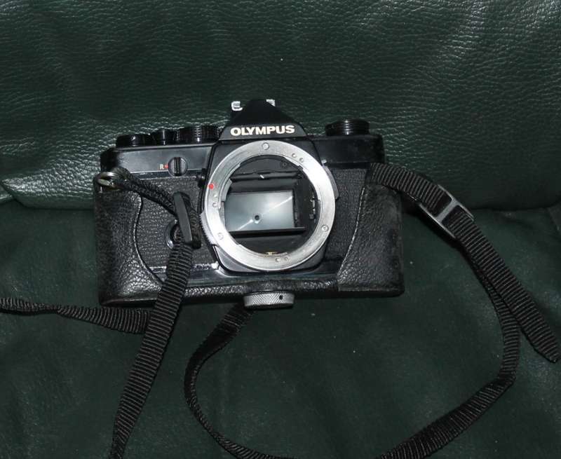 Olympus OM 1 Film Camera with three lenses