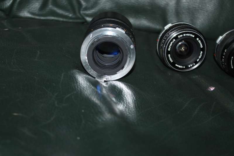 Olympus OM 1 Film Camera with three lenses
