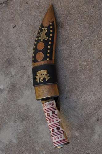 VINTAGE GURKHAN DAGGER IN LEATHER SCABBARD AND CARVED BONE HANDLE
