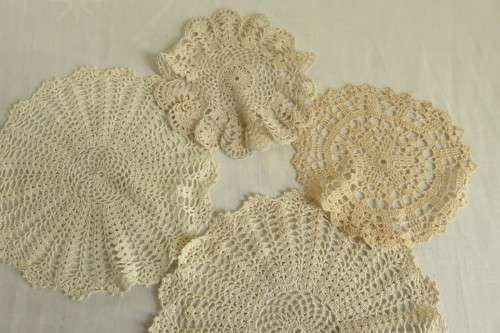 Four crochet doilies - cream, ecru