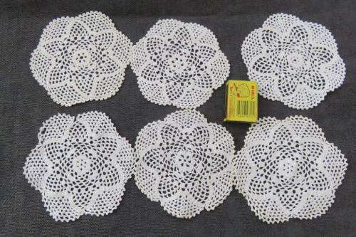 Six off-white doilies 14cm