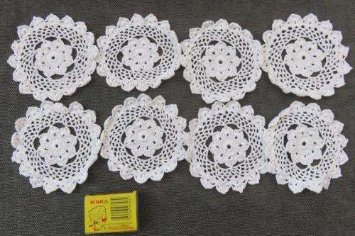 8 small white doilies