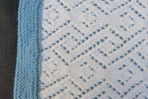 Knitted baby cot blanket - blue and white