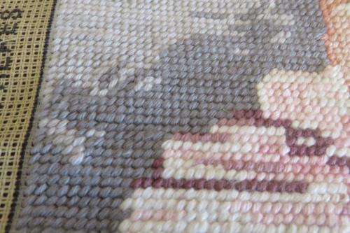 Completed tapestry of a clown