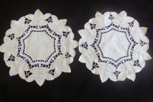 Two pale green cutwork doilies 23cm
