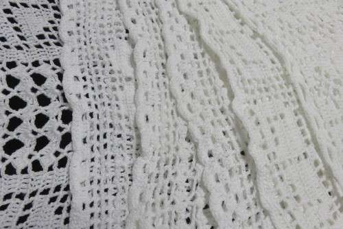 Six white crochet table mats or tray cloths
