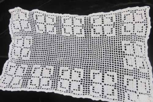 Six white crochet table mats or tray cloths