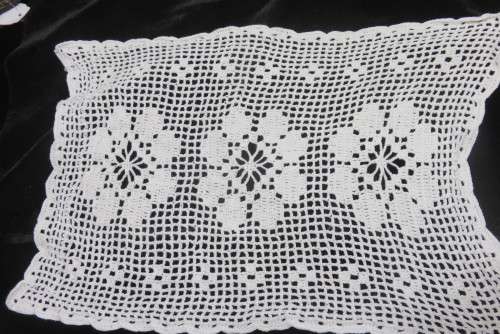Six white crochet table mats or tray cloths