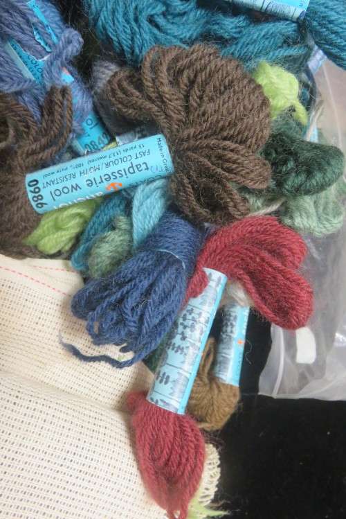 Partially completed tapestry with wools