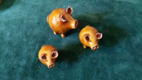 Three little pottery pigs for the printer's tray