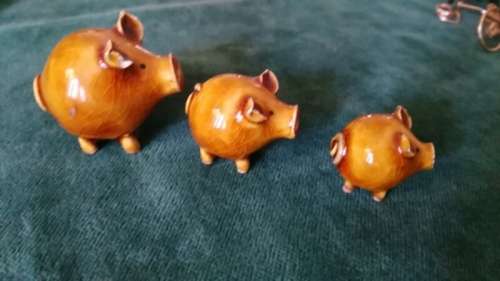 Three little pottery pigs for the printer's tray