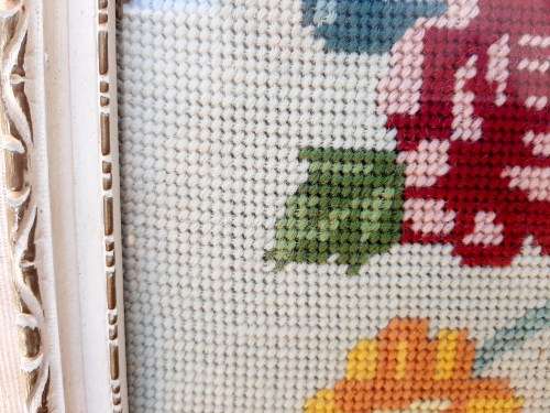 Charming tapestry of  flowers in vintage frame.