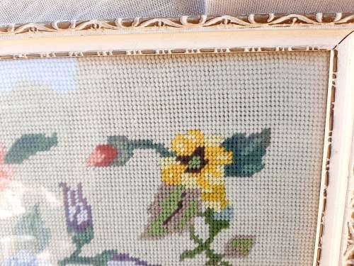 Charming tapestry of  flowers in vintage frame.
